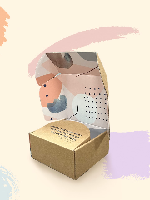 beauty mailer box with pastel colored shapes