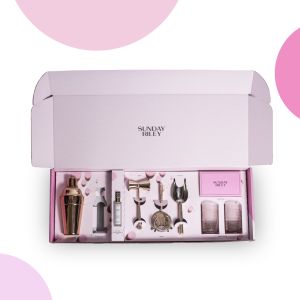 pink Sunday Riley mailer box with drink mixing tools